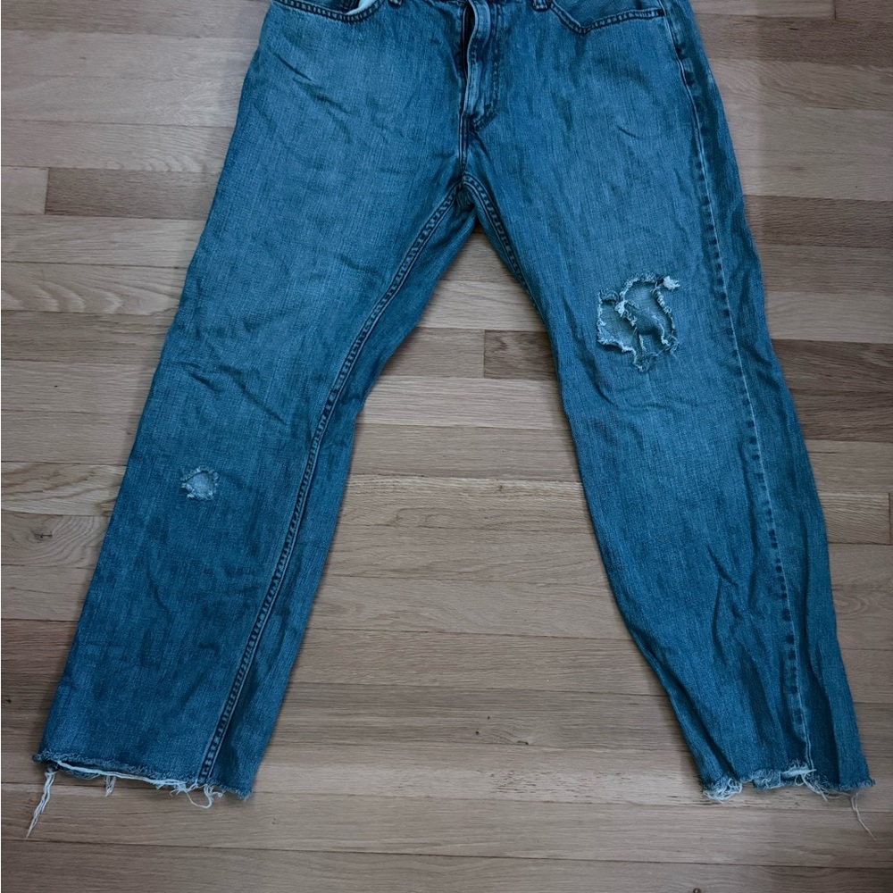 Levi’s Relaxed Blue Denim Jeans with Distressed Details